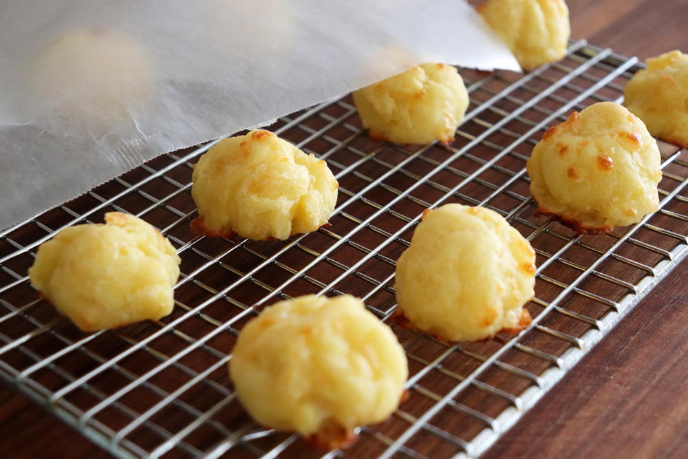 The baked puffs on a cooling rack - store lightly covered with waxed paper