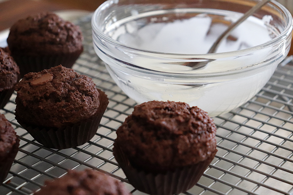 Powdered Sugar glaze in a glass bowl with the doughnuts ready to dip!