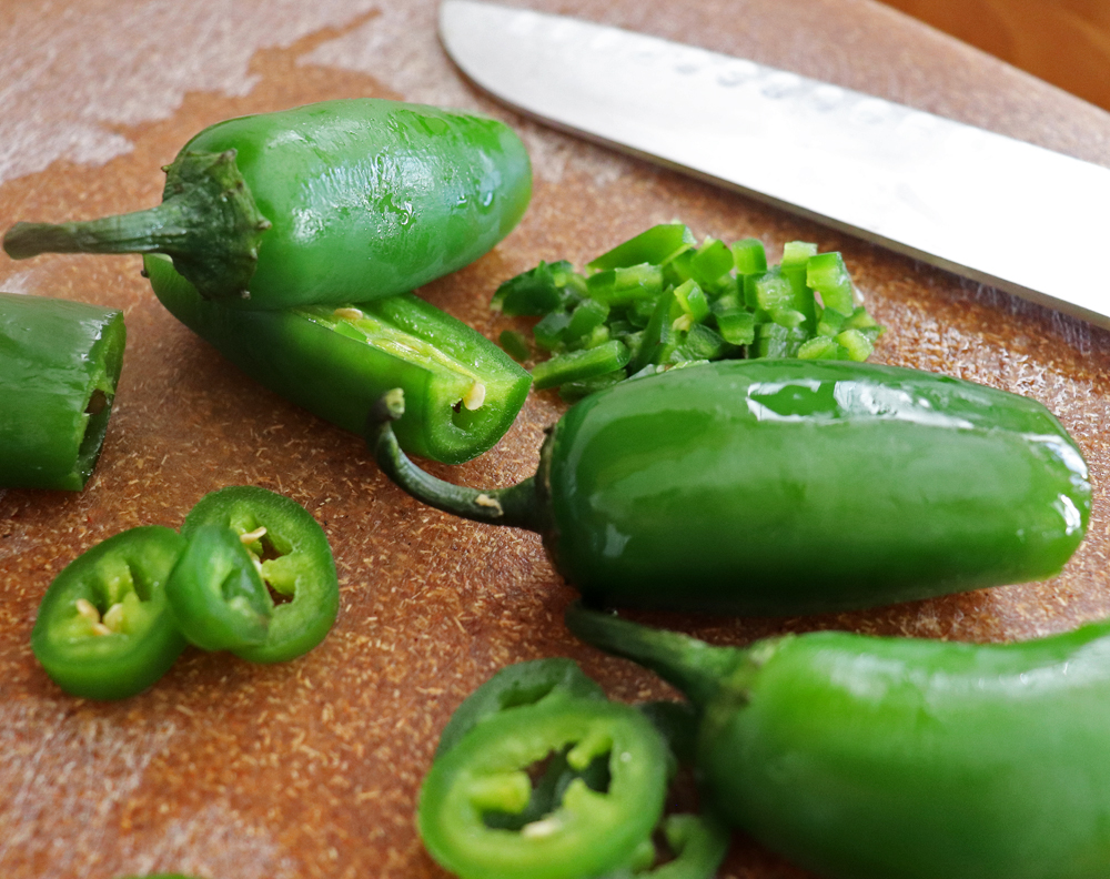 Cutting jalapenos, some dices and some slices for the tops
