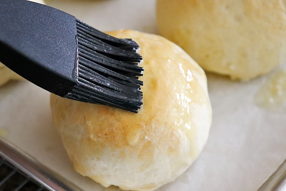 Brushing with butter after baking for Super Soft Sesame Rolls