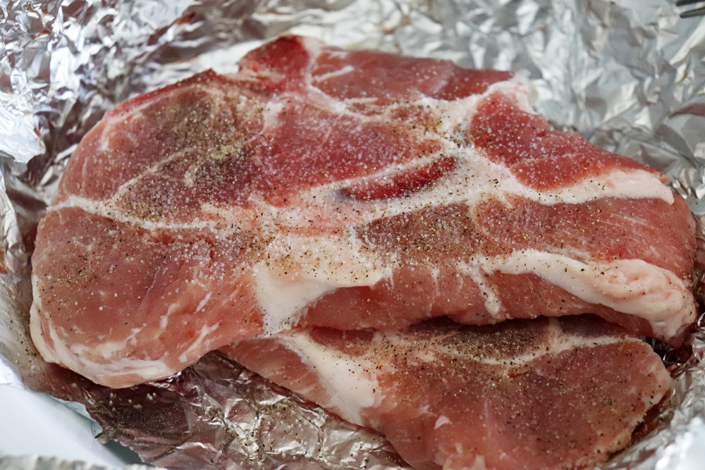 Seasoning the pork chops